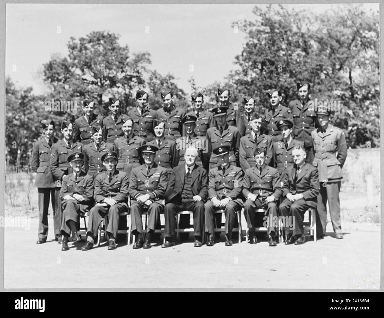 HIGH COMMISSIONER VISITS NEW ZEALAND AIRMEN AT R.A.F. BOMBER STATION. - [Picture issued 1942] Mr. W.J. Jordan, High Commissioner for New Zealand, visited an R.A.F. Bomber Station, where he was photographed with air crews from New Zealand. The New Zealand High Commissioner with men of the bomber station - left to right - Front Row Squadron Leader Gamble, Squadron Leader Thiele, Air Vice Marshal Carr CBE.,DFC.,AFC., Mr. W.J. Jordan, High Commissioner; Croup Captain C.Graham, MC., Squadron Leader P.B. Robinson, and Mr. S.Skinner of New Zealand House Royal Air Force Stock Photo