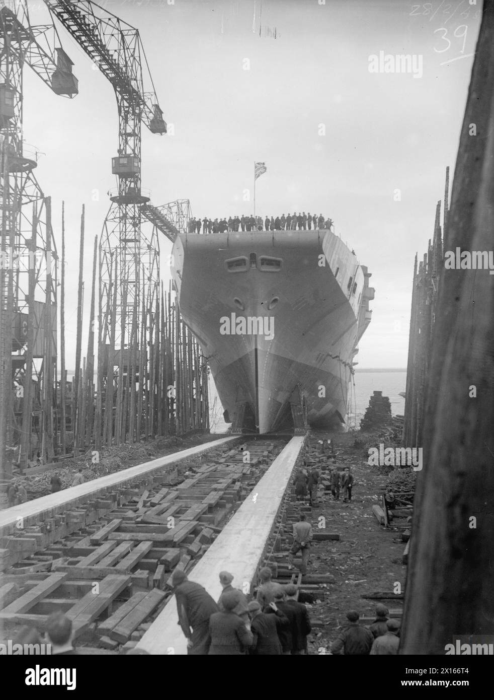 LAUNCH OF THE MAJESTIC. 28 FEBRUARY 1945, VICKERS-ARMSTRONG LTD, BARROW-IN-FURNESS. THE LAUNCH OF THE AIRCRAFT CARRIER HMS MAJESTIC BY LADY ANDERSON, WIFE OF THE RT HON SIR JOHN ANDERSON. - The MAJESTIC going down the slipway Stock Photo