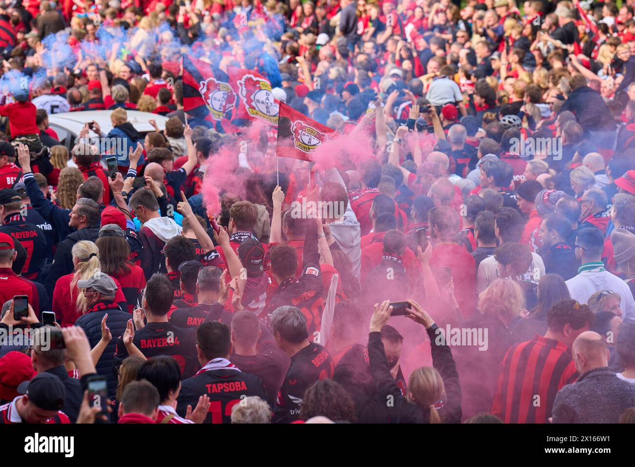 Fans celebrate the arrival of the team  before the match BAYER 04 LEVERKUSEN - SV WERDER BREMEN 5-0   on April 14, 2024 in Leverkusen, Germany. Season 2023/2024, 1.Bundesliga,, matchday 29, 29.Spieltag Photographer: ddp images / star-images    - DFL REGULATIONS PROHIBIT ANY USE OF PHOTOGRAPHS as IMAGE SEQUENCES and/or QUASI-VIDEO - Stock Photo