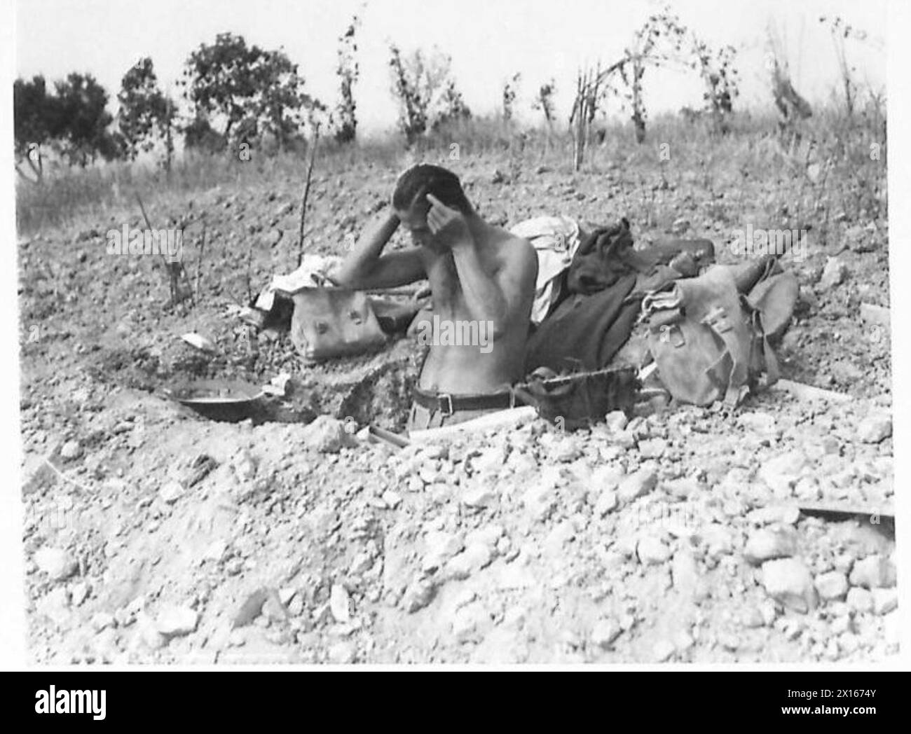 Gunner M. Bernstein of 331 Battery performing personal hygiene in a ...