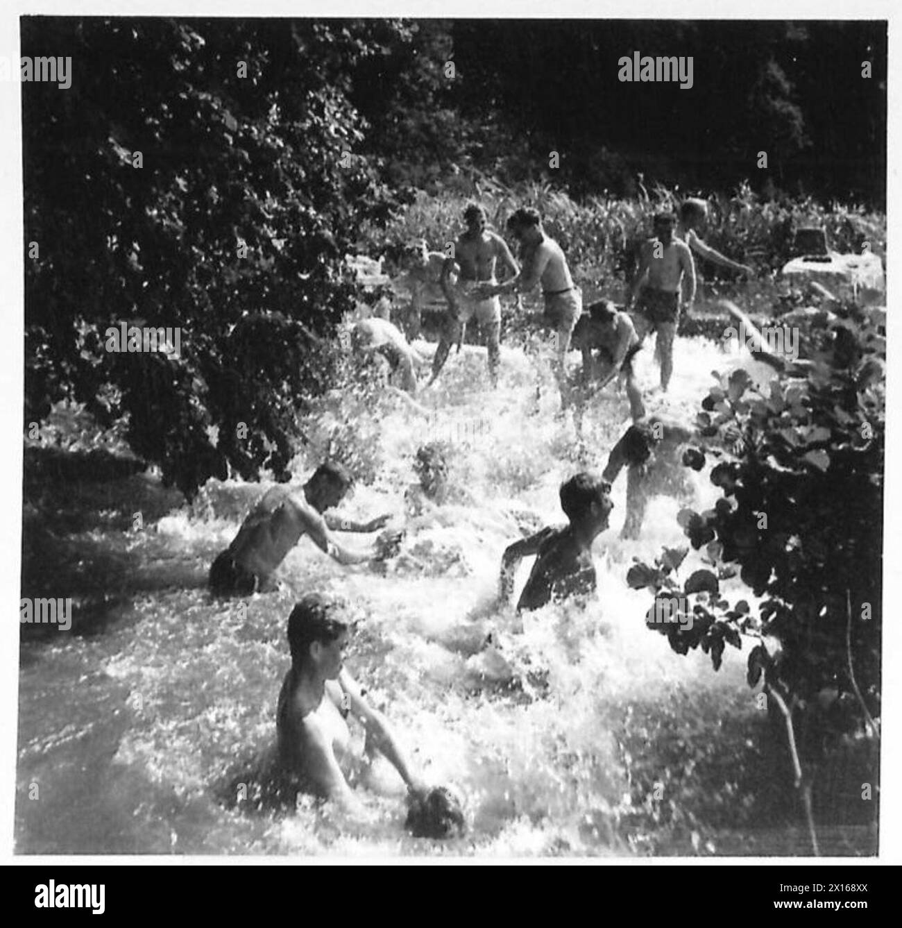 French recruits bathe in a stream during training as part of the ...
