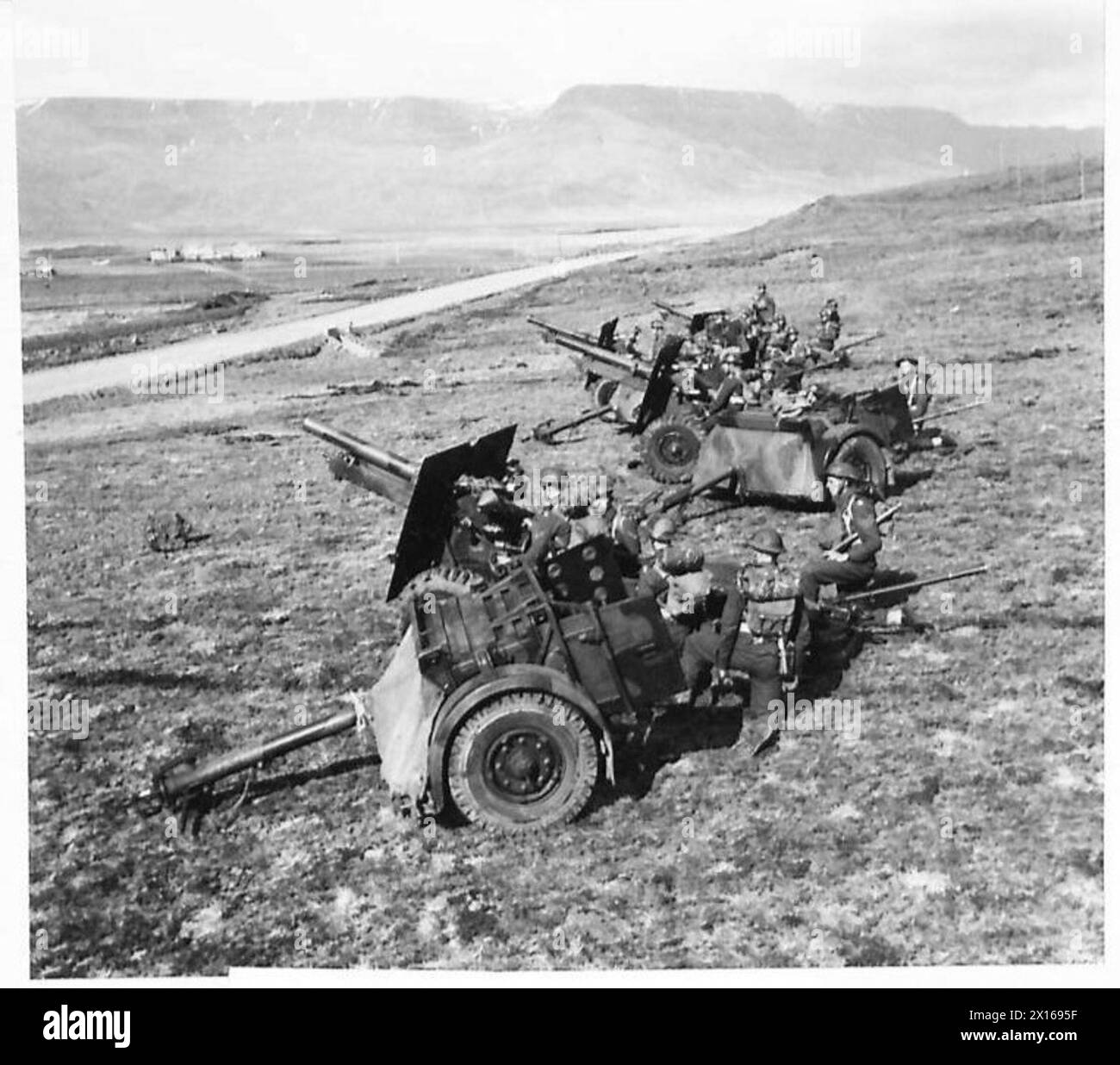 Command Field Gun British troops in Iceland move field guns into position for a practice ...