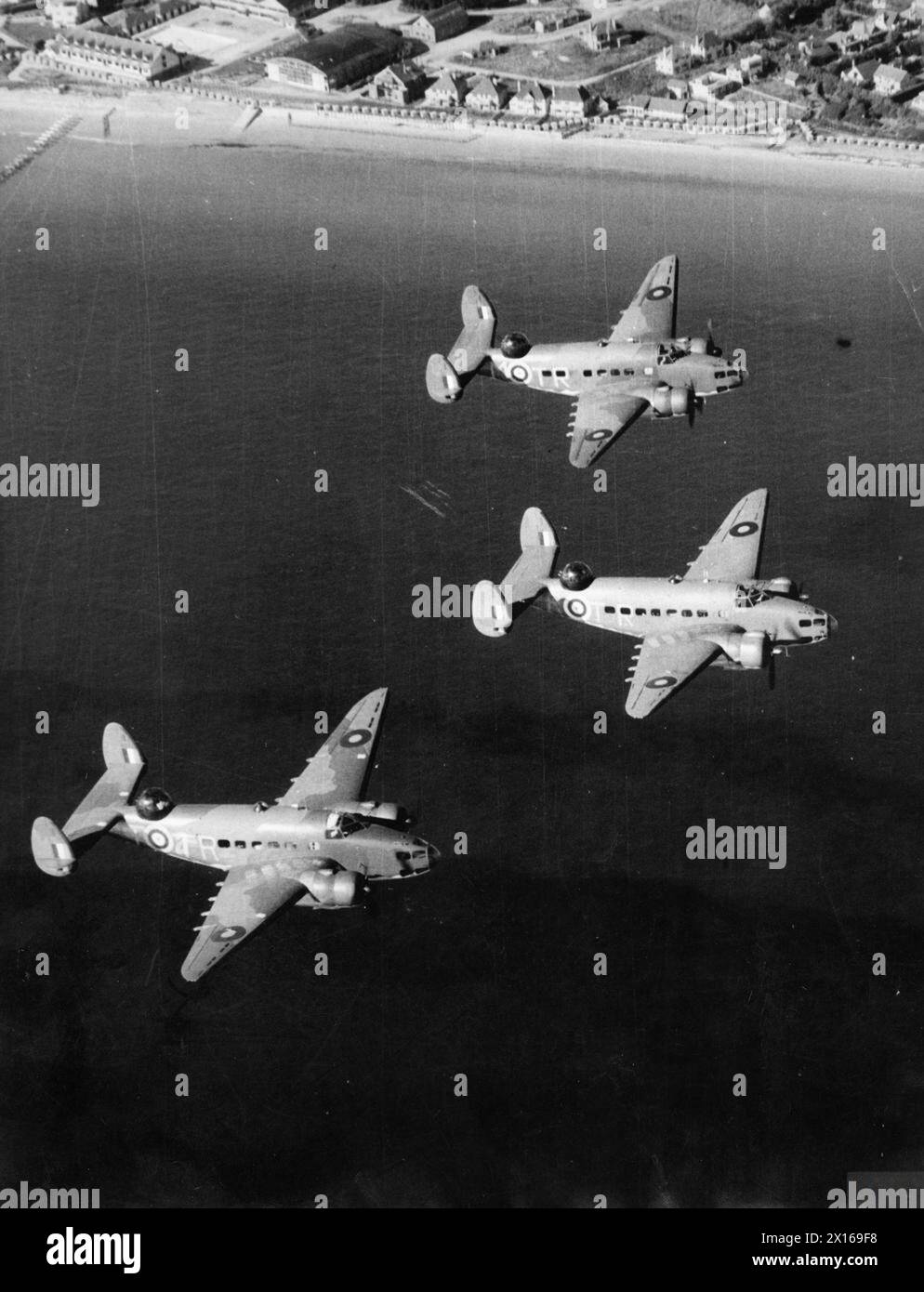 Three Lockheed Hudsons of No. 59 Squadron RAF fly in 'vic' formation ...