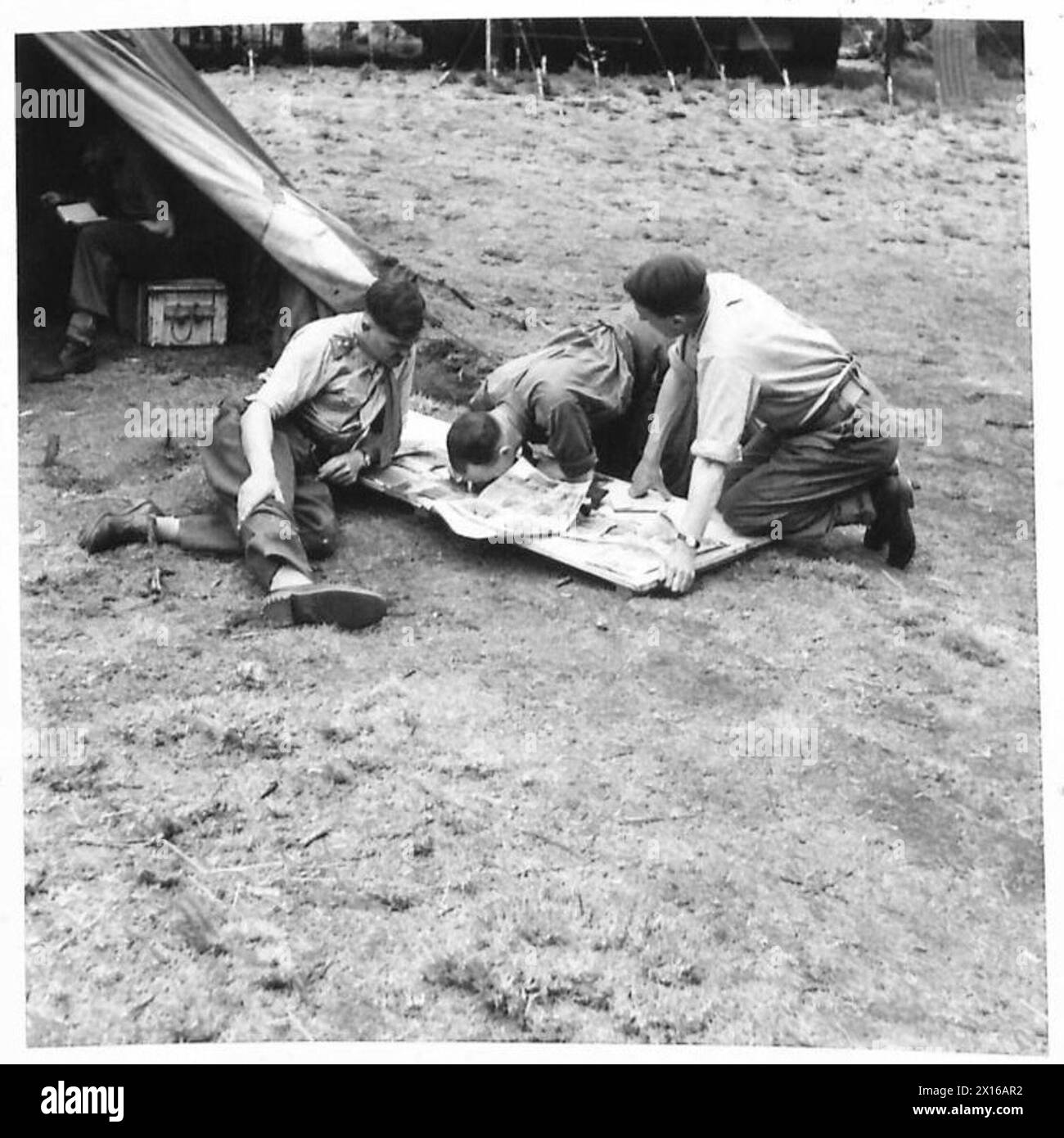 Marine Commandos review an air reconnaissance photograph; Lieutenant ...
