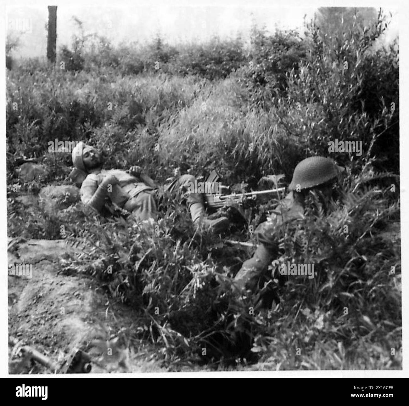 Indian Engineers of the Indian Division rest after bridge-building and minefield clearing during the Eighth Army attack on the Gustav Line, British Army. Stock Photo