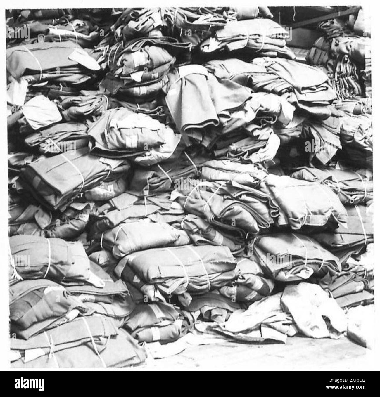 ARMY CLOTHING DEPOT - Greatcoats ready for despatch British Army Stock Photo