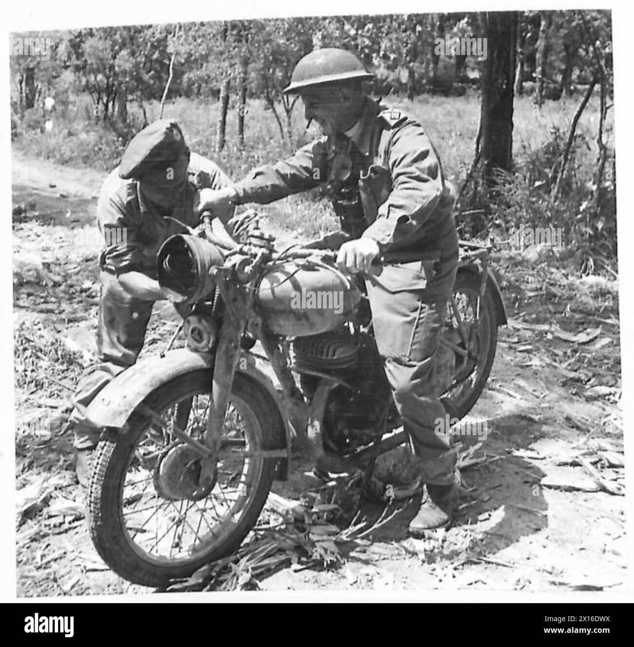 EIGHTH ARMY : THE BREAK THROUGH THE HITLER LINE - The Rev. E. Elworthy of the Northants Regiment, who hails from Tiverton, Devon, seated on his motorcycle The padre captured a German paratrooper who was attempting to escape on this machine British Army Stock Photo