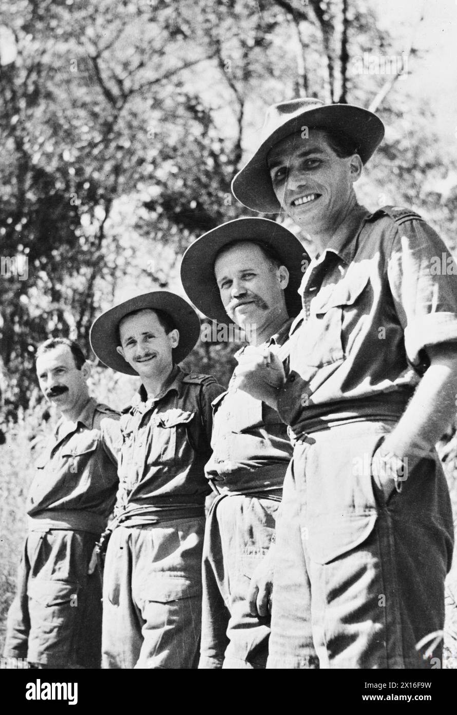 POLISH OFFICERS IN THE ROYAL WEST AFRICAN FRONTIER FORCE - Polish officers serving with the 1st Battalion, Gambia Regiment (6st West African Infantry Brigade, 81st West African Division) during the Third Arakan Campaign.Left to right:Lieutenant Adam Grzywacz, D and X Companies; Lieutenant Wiesław Bulkowski (or Bułkowski), Mortar Platoon; Captain Jan K. Żeleźnik MC, Mortar Platoon and A Company; Major Stanisław Lisiecki, the CO of the B Company Polish Army, Royal West African Frontier Force, Royal West African Frontier Force, 81st West African Division, Royal West African Frontier Force, 81st W Stock Photo