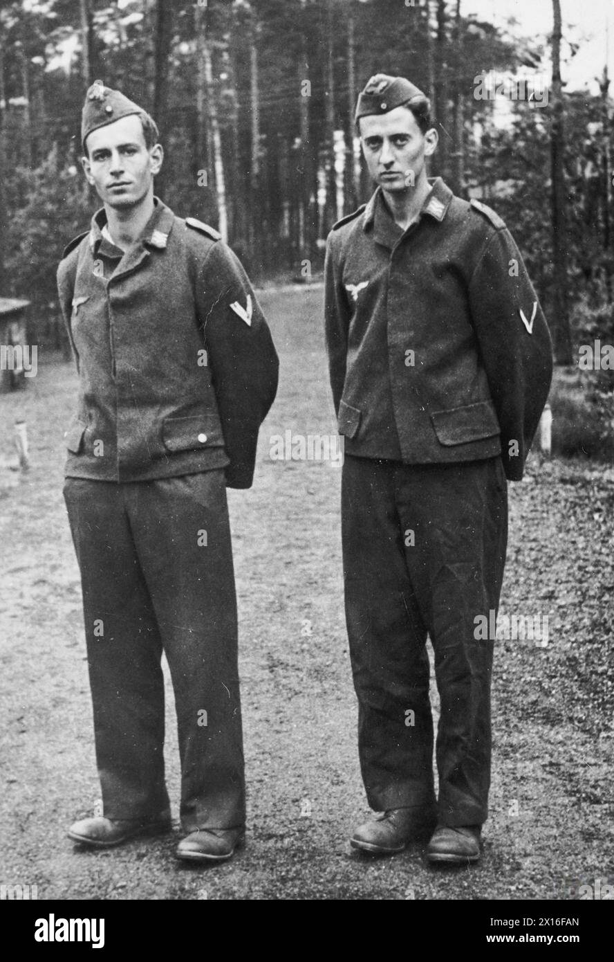 ALLIED PRISONERS OF WAR IN GERMANY, 1939-1945 - Two RAF officers, Patrick Lorne Welch and Flight Lieutenant Walter Morrison DFC, who tried to escape from Stalag Luft III, Sagan on 12 June 1943 (during so called delousing break) disguised as German airmen. Photograph taken just after their recapture on the aerodrome near Sagan, probably 12 June 1943 Royal Air Force, Welch, Patrick Palles Lorne Elphinstone, Morrison, Walter McDonald Stock Photo