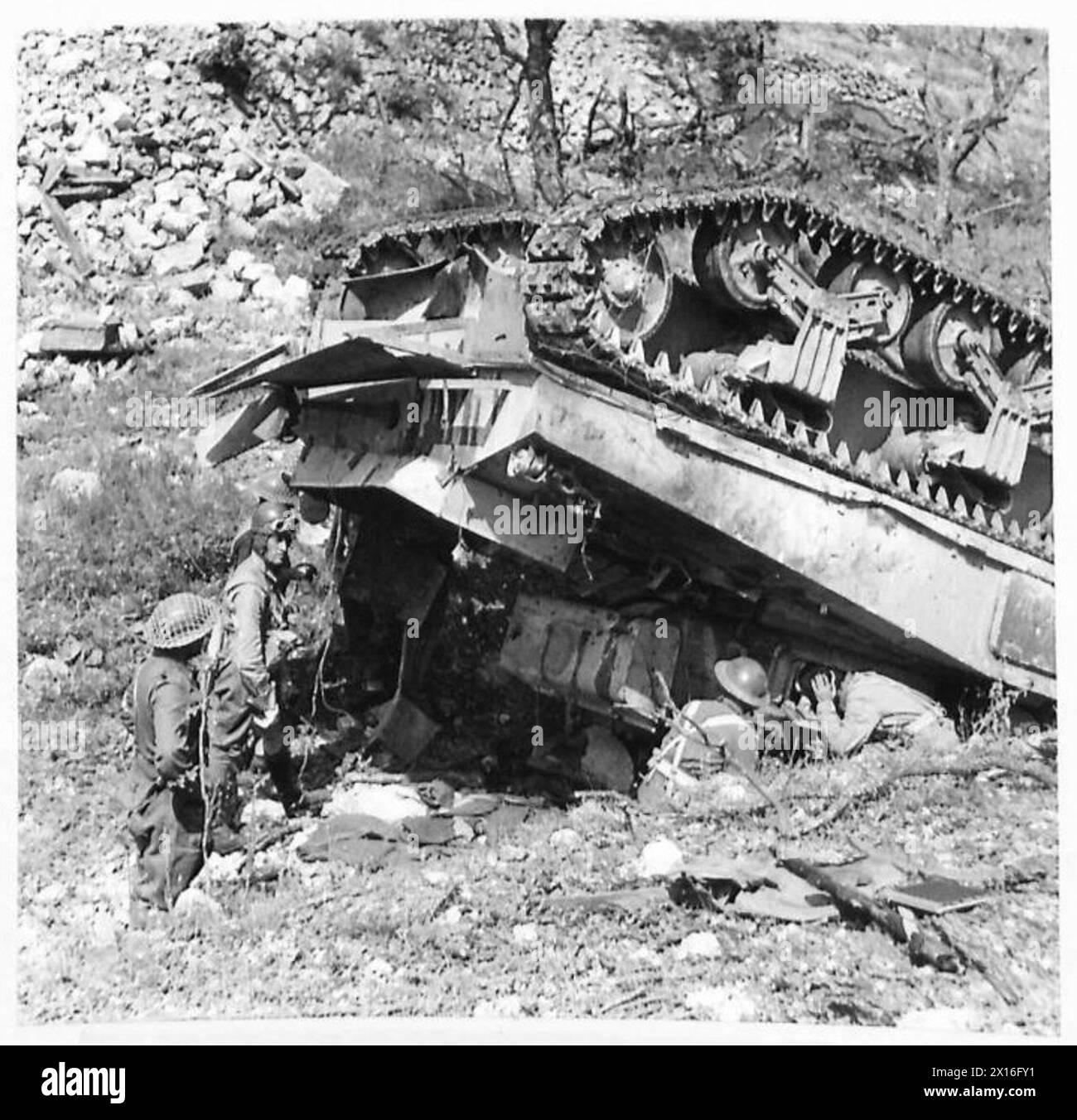 THE POLISH ARMY IN THE ITALIAN CAMPAIGN, 1943-1945 - It's the tank named 'Merkury' commanded by Officer Cadet Aleksander Średnicki. It fell down the ravine while reversing to avoid a German counterattack, instantly killing a gunner, Corporal Adam Antoniuk, wounding Średnicki and tank's radiooperator, Private Święcicki. Two drivers (possibly featured in the photograph), Lance Corporals Józef Boryczko and Juliusz Matzenauer, survived the fall although Matzenauer was killed by a mortar grenade a few minutes later. Overturned Sherman tank of the 3rd Squadron, 6th Armoured Regiment (2nd Warsaw Armo Stock Photo