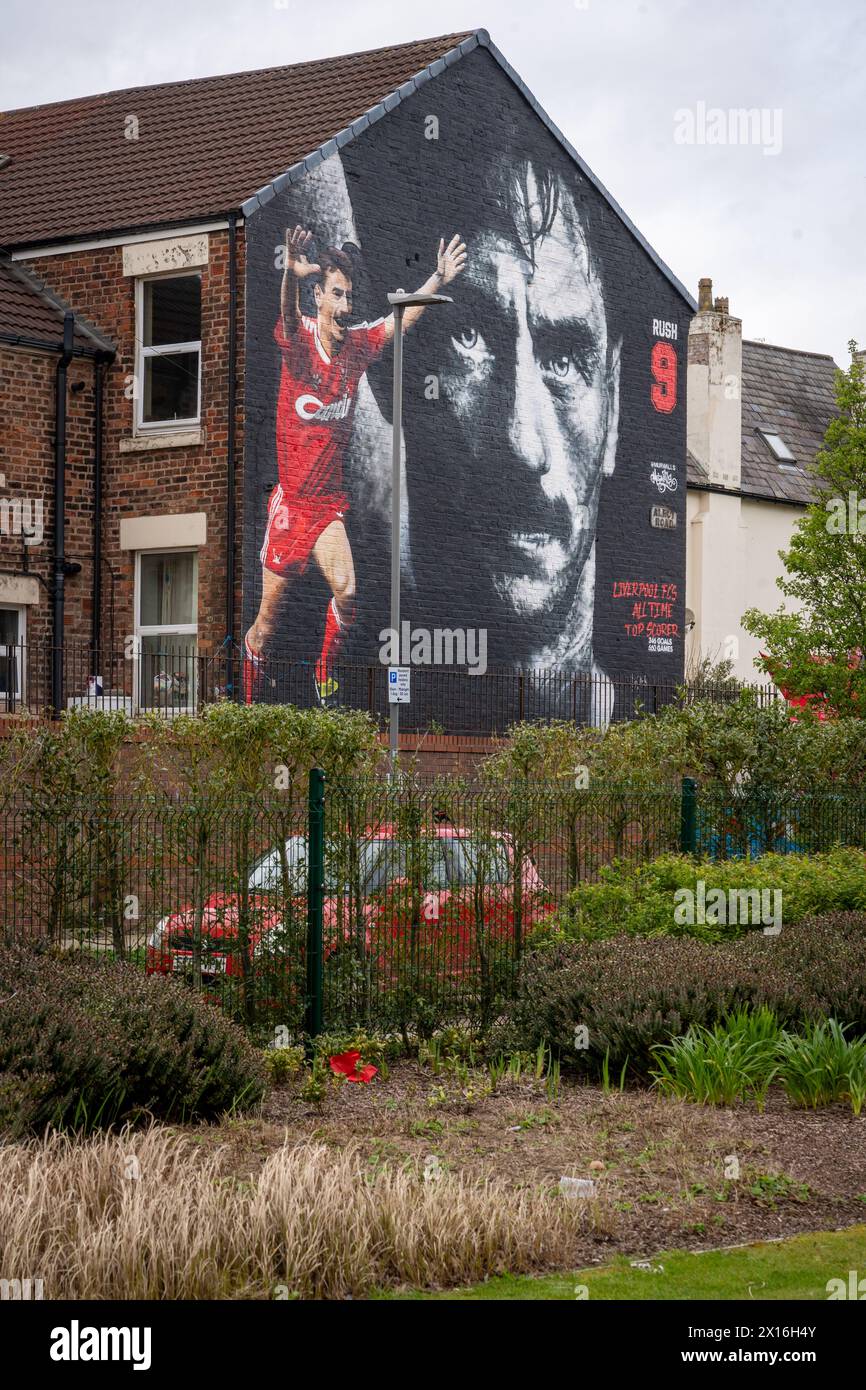 Merchandise selling beneath the Ian Rush mural outside Anfield football stadium, Liverpool Stock Photo