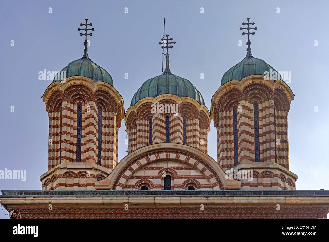 Craiova, Romania - March 16, 2024: Three Towers With Crosses at Metropolitan Cathedral of Saint Demetrius Building in Town Park. Stock Photo