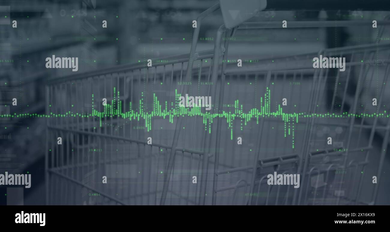 Image of graphs over shopping in market cart Stock Photo