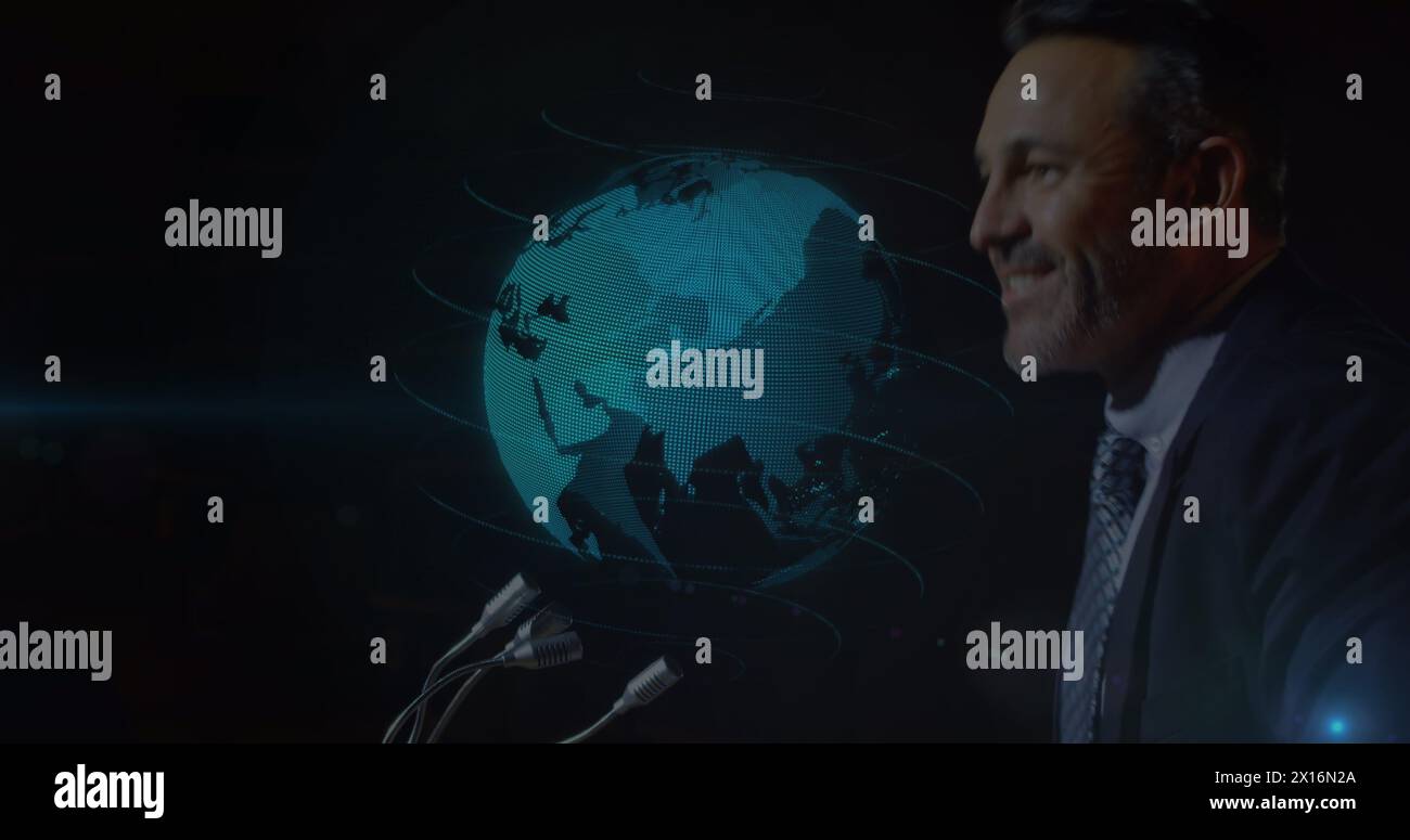Image of globe spinning over caucasian businessman giving speech Stock Photo