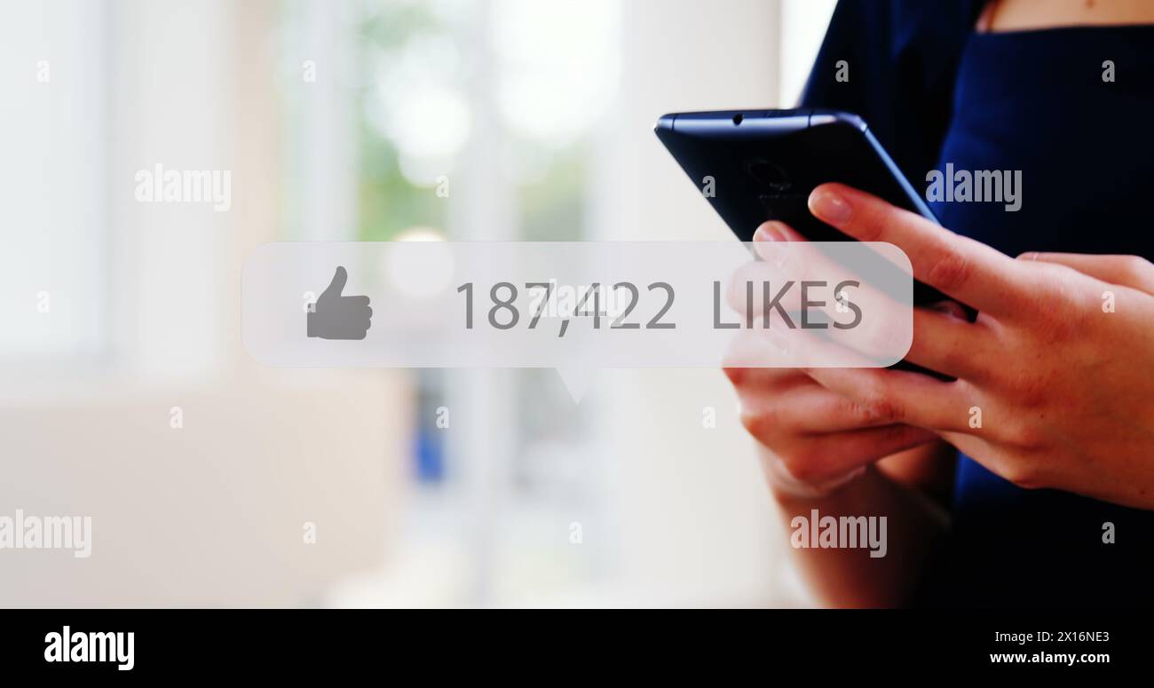 Image of media icon over hands using smartphone Stock Photo