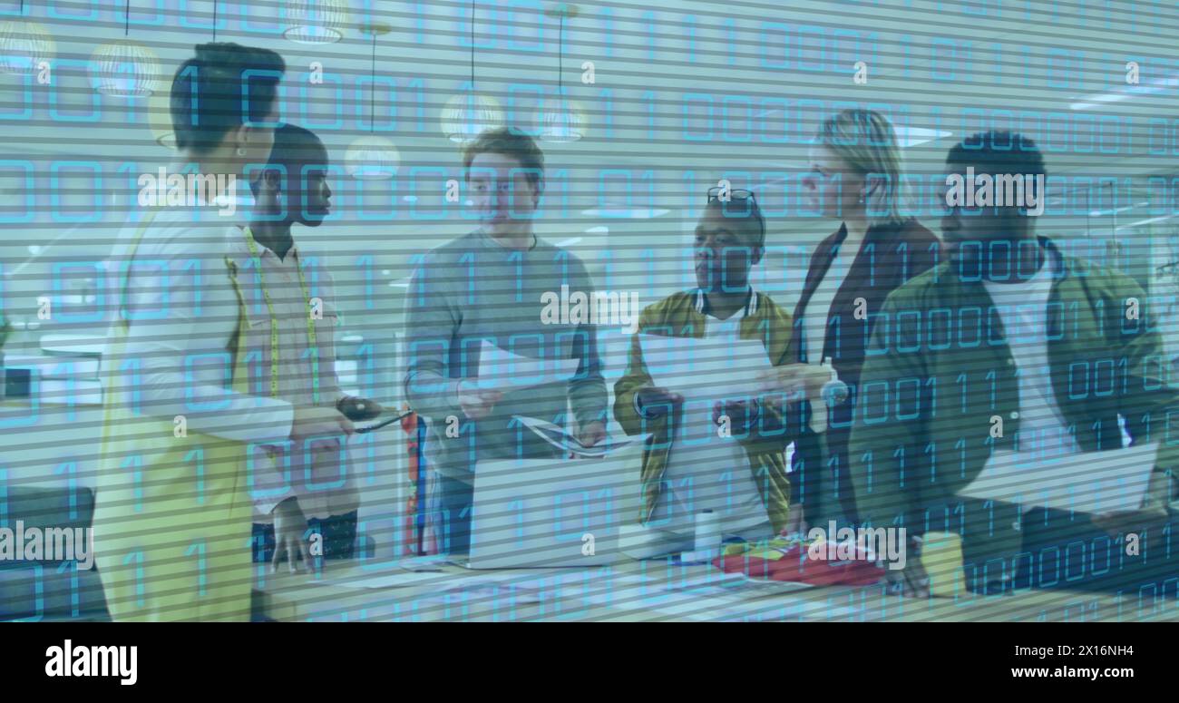 Image of binary code over diverse coworkers talking in office Stock Photo