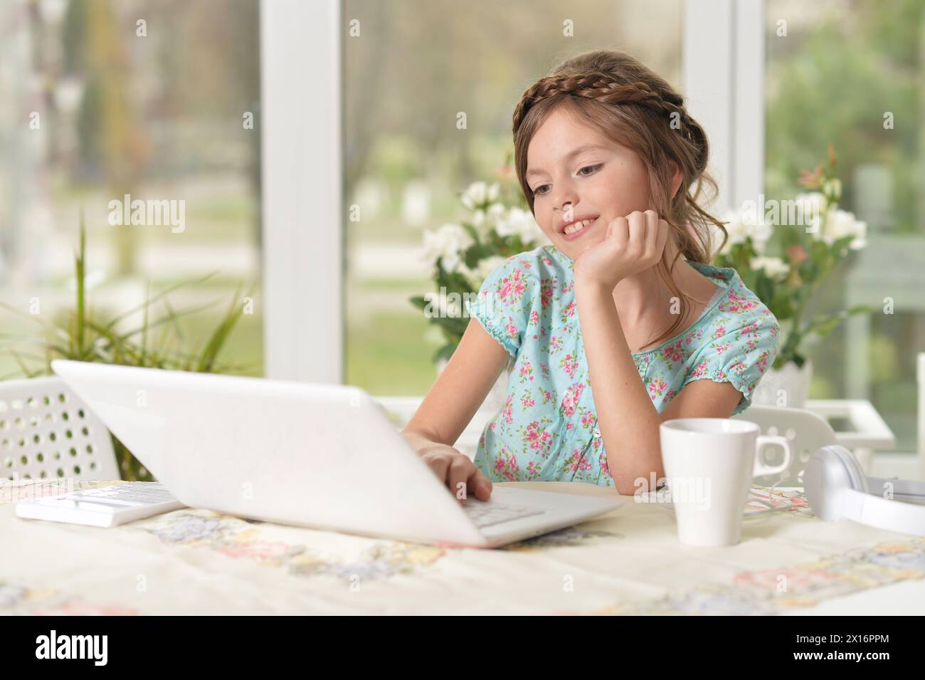 Cute and happy little girl children using laptop computer Stock Photo ...
