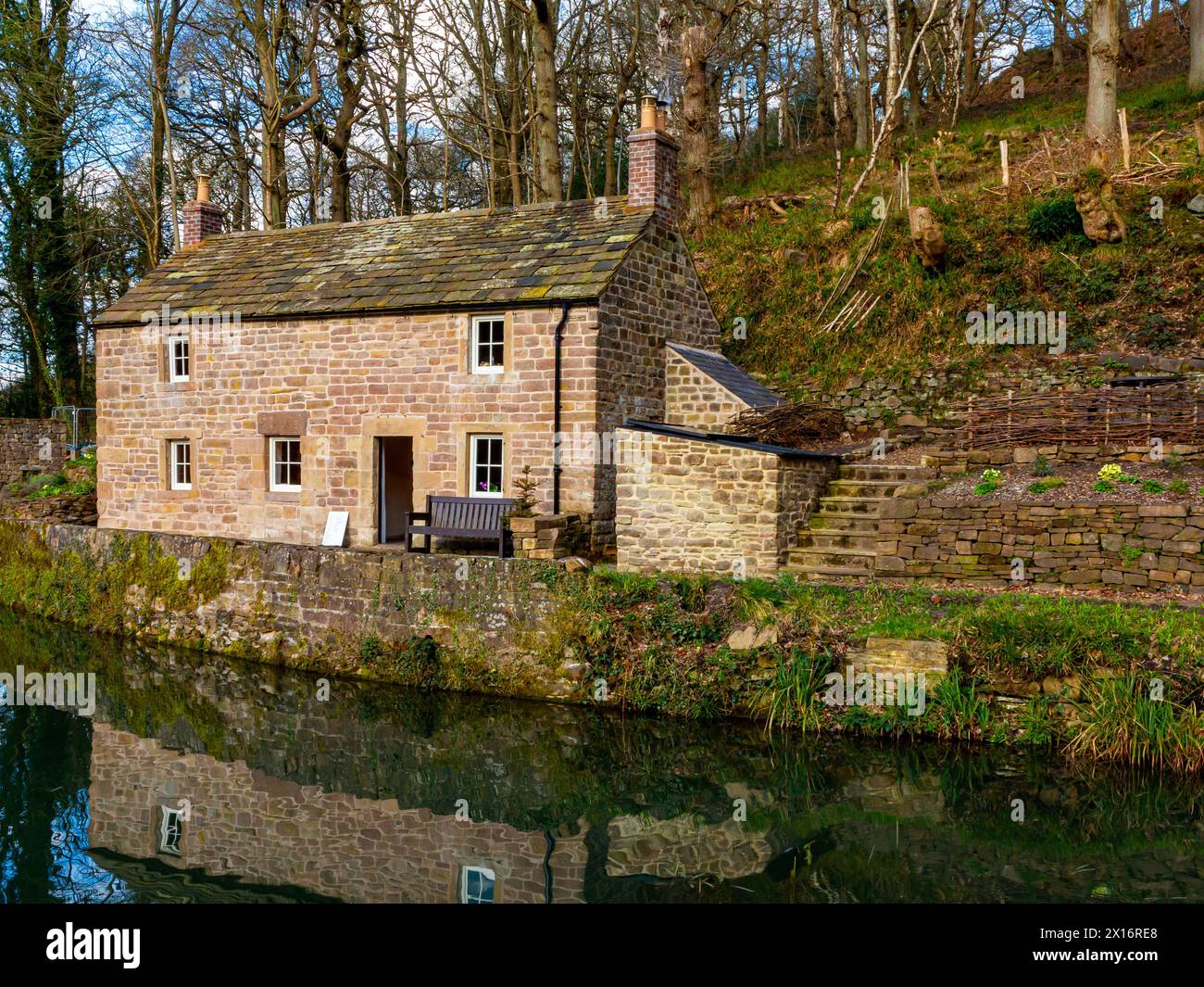 Exterior of Aqueduct Cottage a restored grade ii listed building on the Cromford Canal near Whatstandwell Derbyshire Peak District England UK Stock Photo