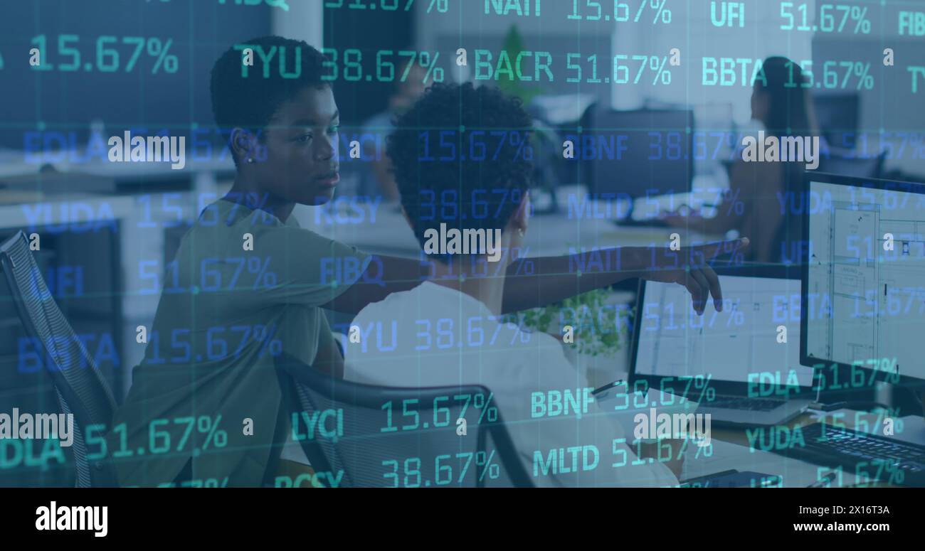 Image of trading board over diverse female coworkers discussing floor plans over desktop Stock Photo