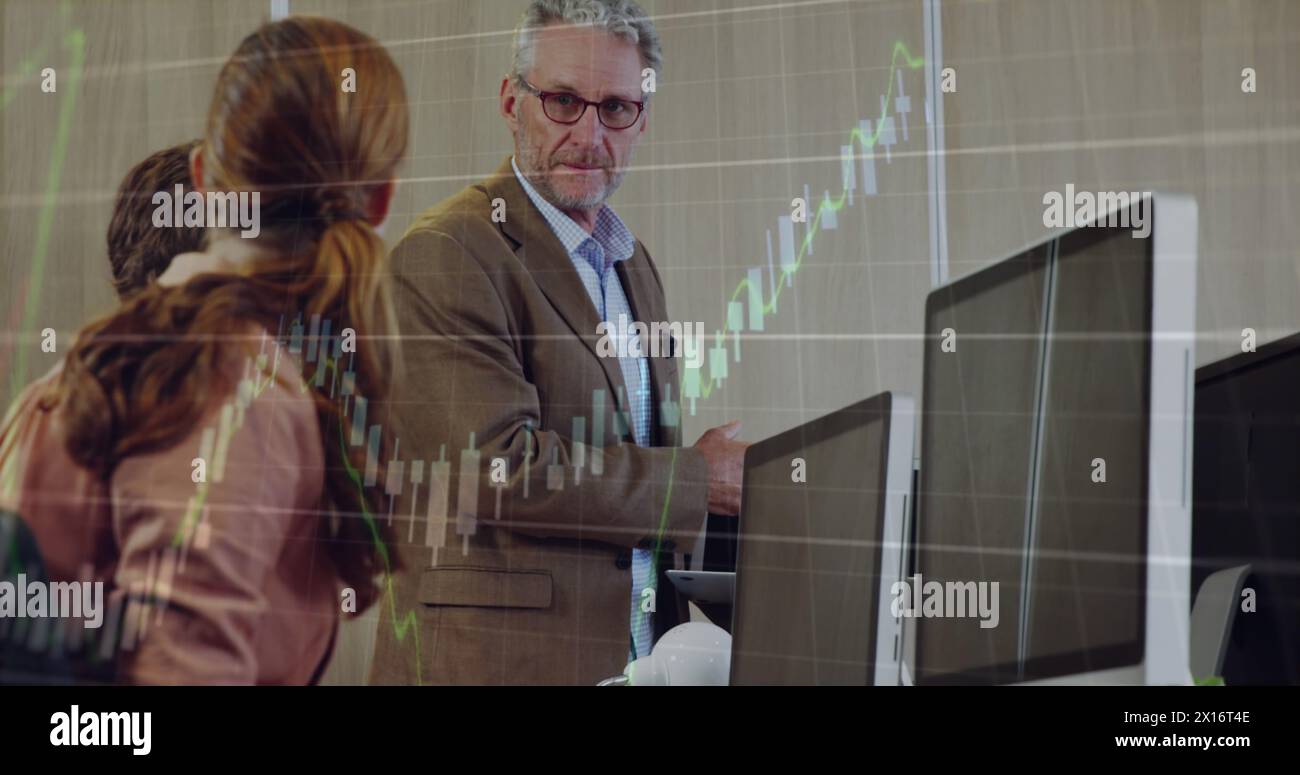 Image of financial data processing over diverse business people at office Stock Photo