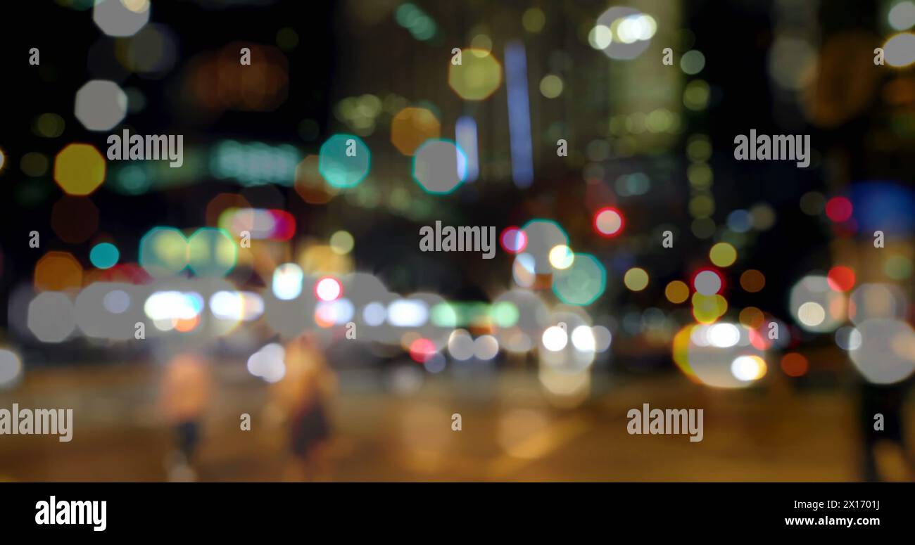 Image of road traffic in city at night with blurred city lights and ...