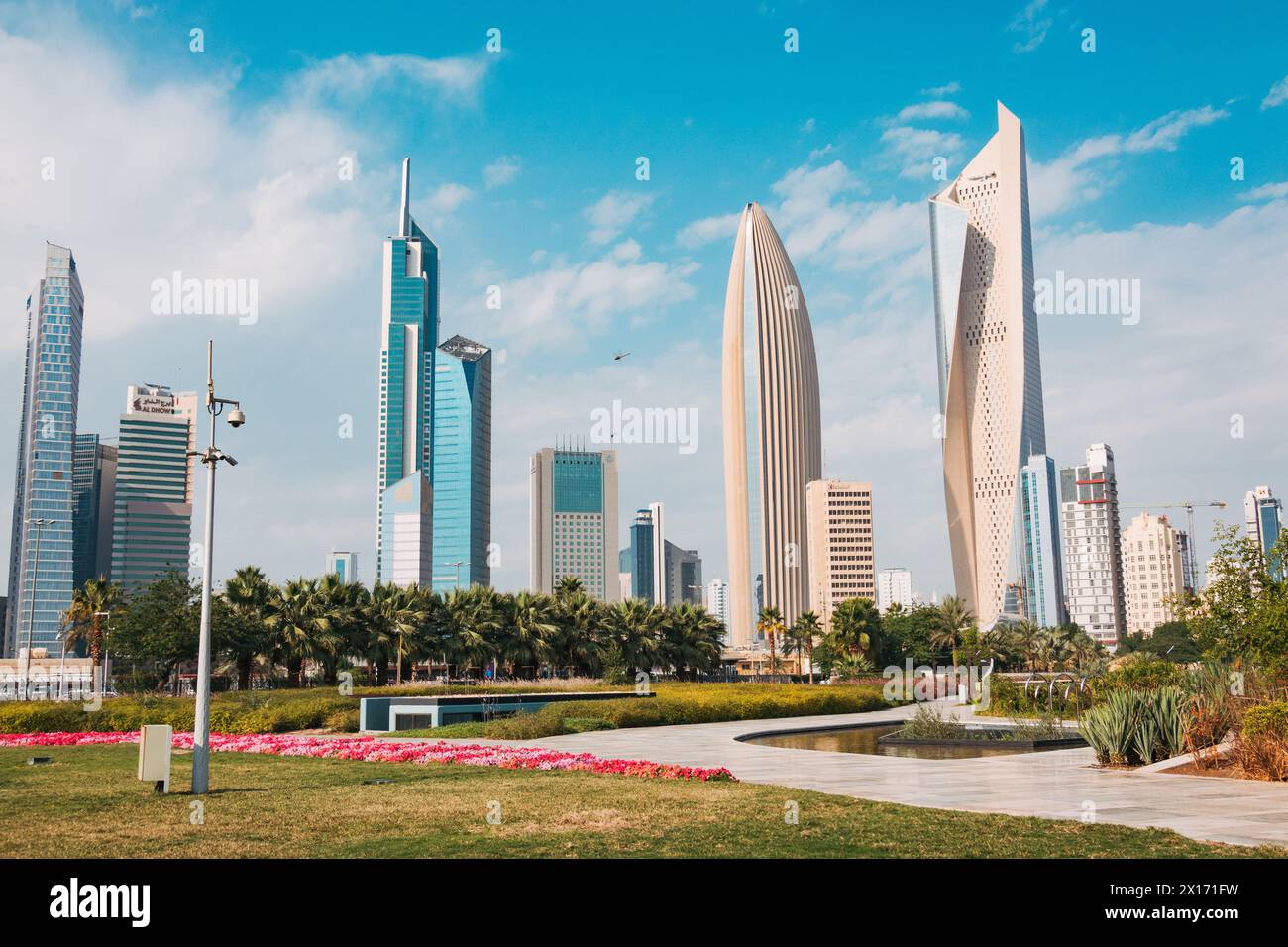 Skyscrapers in the business district of Kuwait City, notably Al Hamra tower, Kuwait's tallest building and world's tallest curved skyscraper Stock Photo