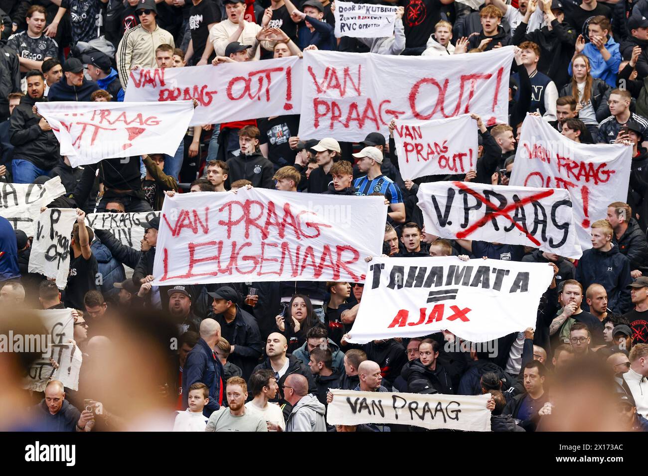 AMSTERDAM - Banners against Chairman of the Supervisory Board of Ajax NV Michael van Praag, Van Praag out! during the Dutch Eredivisie match between Ajax Amsterdam and FC Twente at the Johan Cruijff ArenA on April 14, 2024 in Amsterdam, Netherlands. ANP | Hollandse Hoogte | MAURICE VAN STEEN Stock Photo
