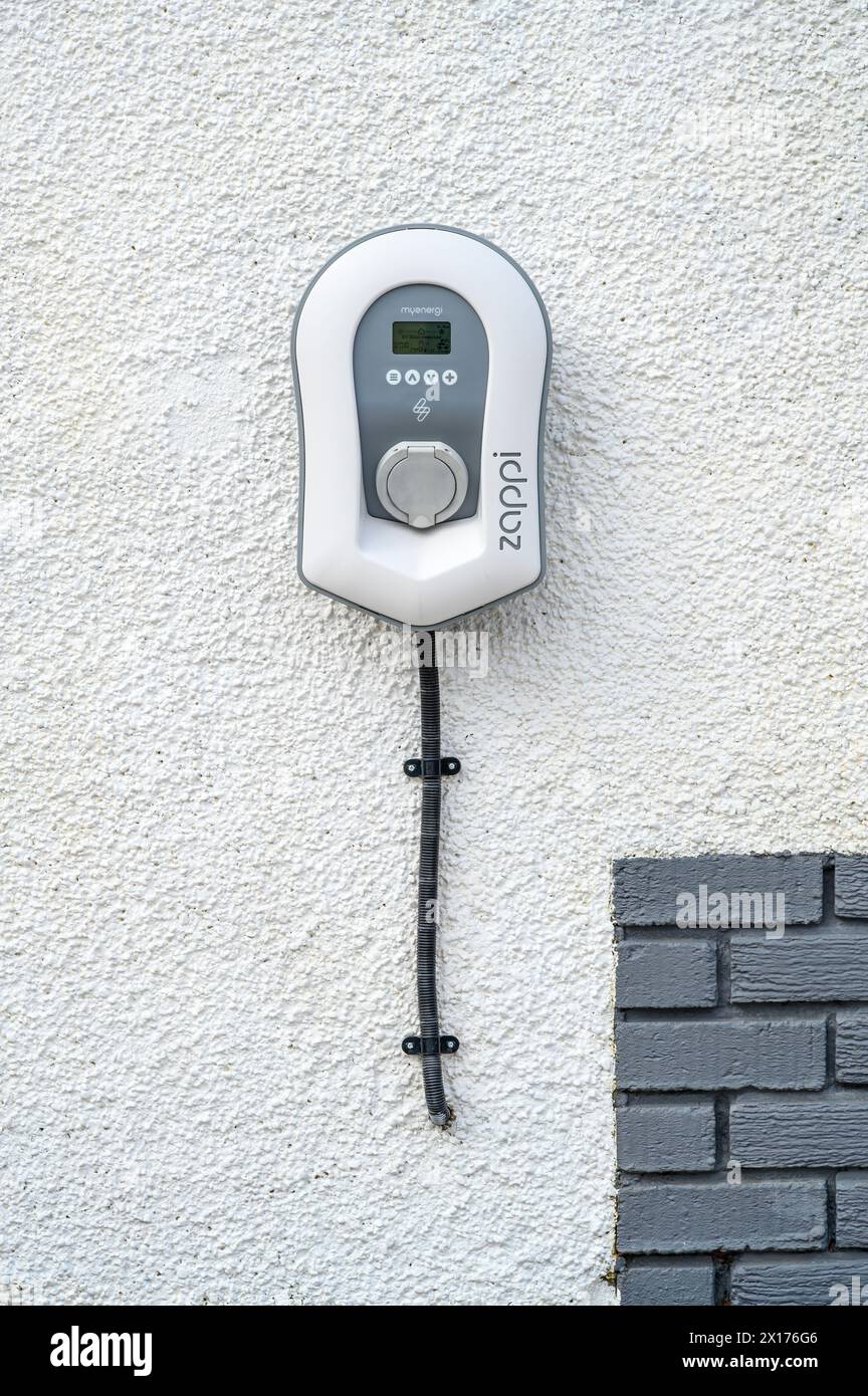 MyEnergi Zappi EV Charger mounted on an exterior wall at home, UK, Europe Stock Photo
