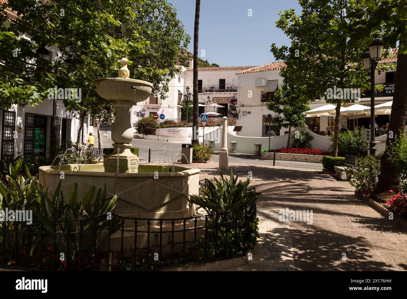 Fountain on the cozy square surrounded by shops and restaurants in the mountain village of Mijas, Andalusia; Costa del Sol, Spain. Stock Photo