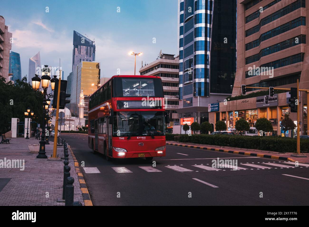 a red double decker public bus in Kuwait City, Kuwait Stock Photo