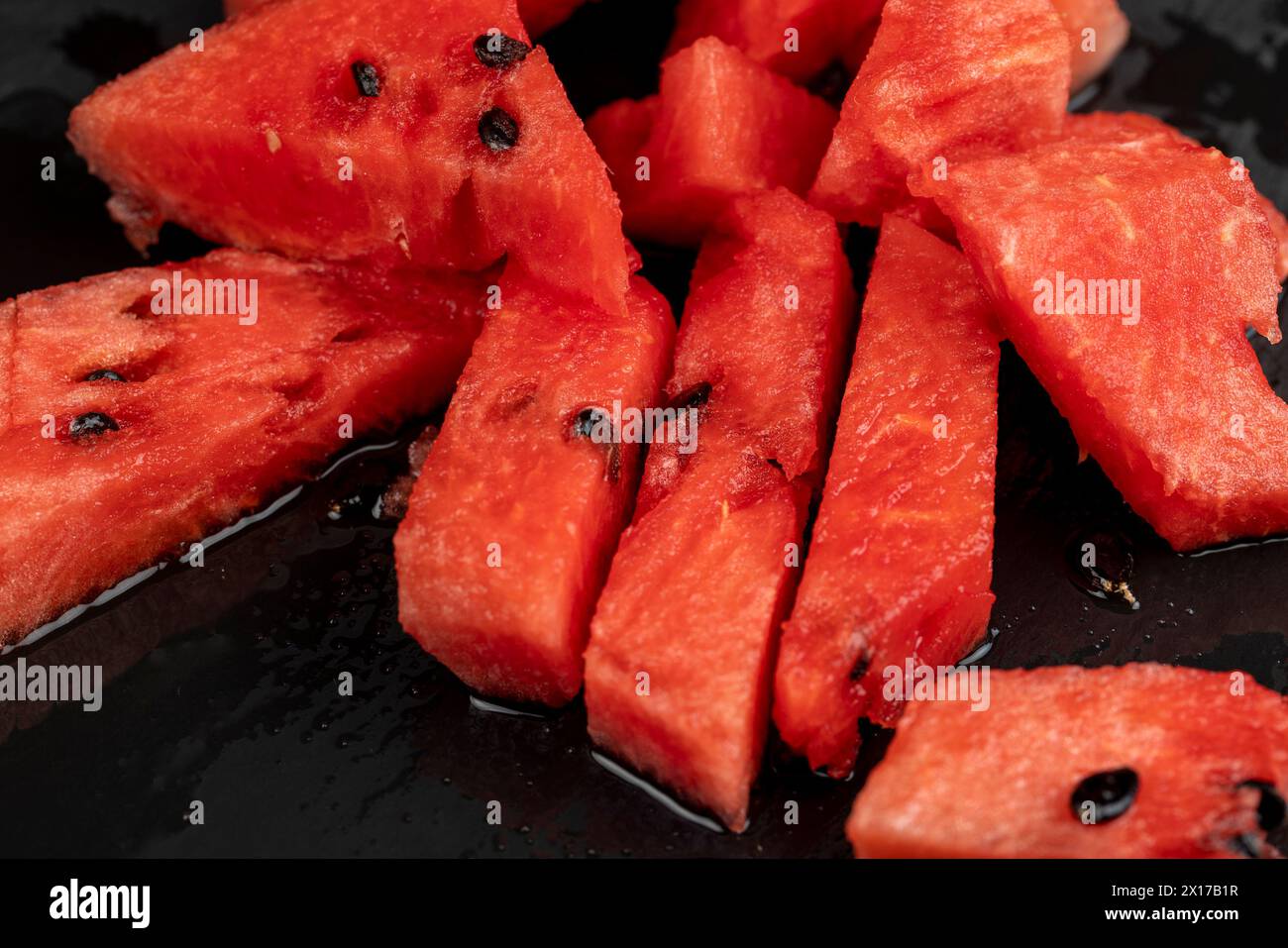 sliced into pieces of red ripe watermelon, the pulp of a ripe ...