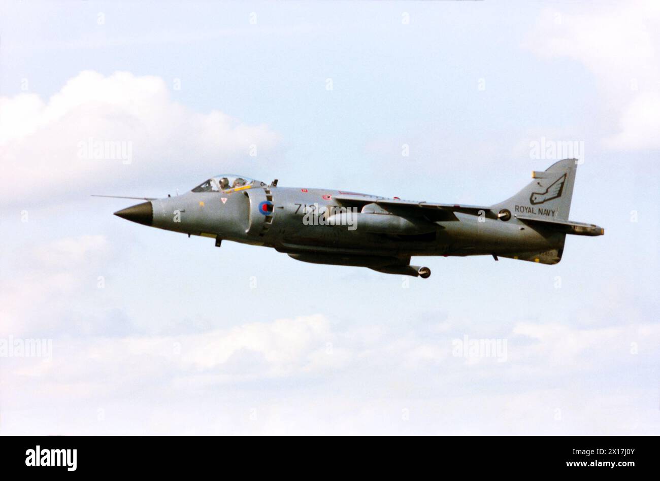 British Aerospace Sea Harrier FRS1 Royal Navy jet fighter XZ455 flying at the Farnborough International Airshow 1988. XZ455 saw combat in the Falklands War and is credited with shooting down a number of Argentinian aircraft. Following conversion to Sea Harrier FA2 with upgraded radar and systems the fighter ditched in the Adriatic Sea after a mission over Bosnia on February 14, 1996 Stock Photo