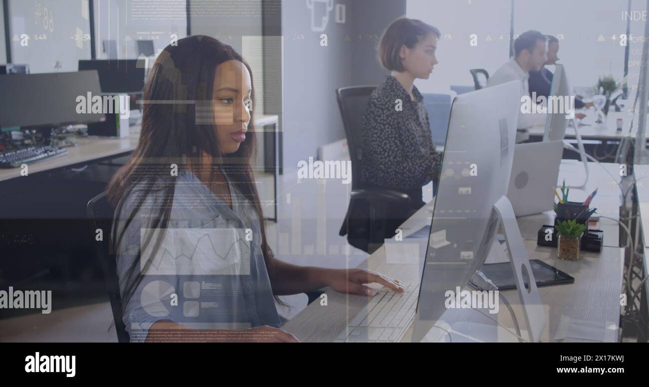 The colleagues are typing on their computers Stock Photo
