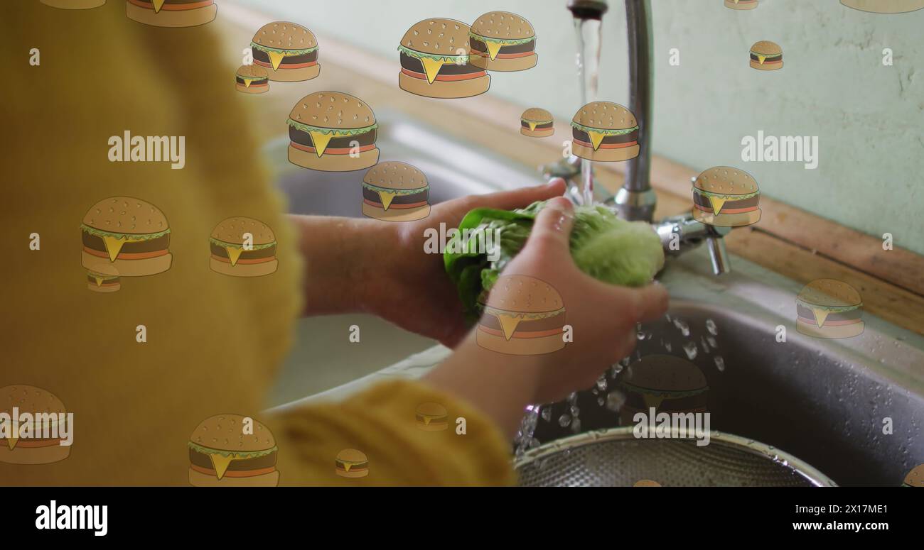 Image of hamburger icons over caucasian woman washing salat Stock Photo