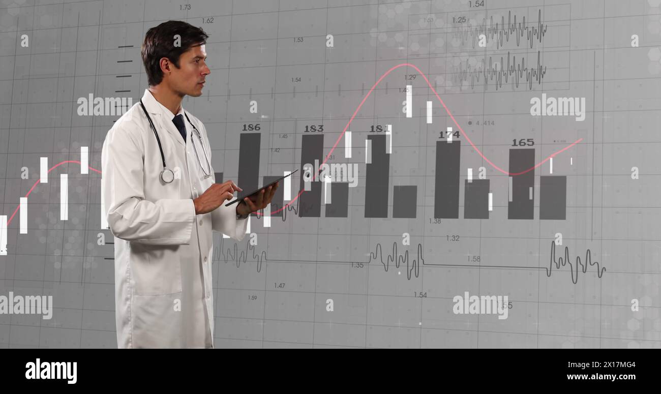 Image of financial data and graphs over caucasian male doctor Stock Photo