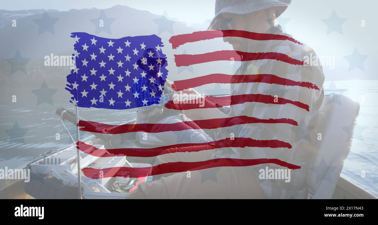 Image of drawn American flag over two men fishing in a boat in the background Stock Photo