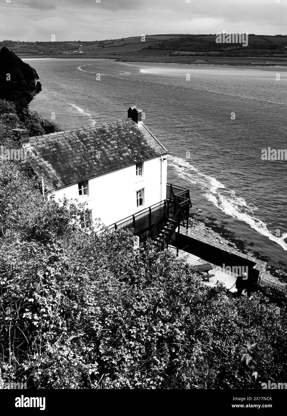 Dylan Thomas’ boathouse, overlooking the estuary where the river Taf flows into Carmarthen Bay at Laugharne. Stock Photo
