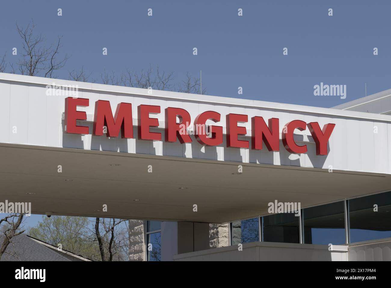 Emergency Room ER and Emergency Department entrance sign for a hospital in alert red. Stock Photo