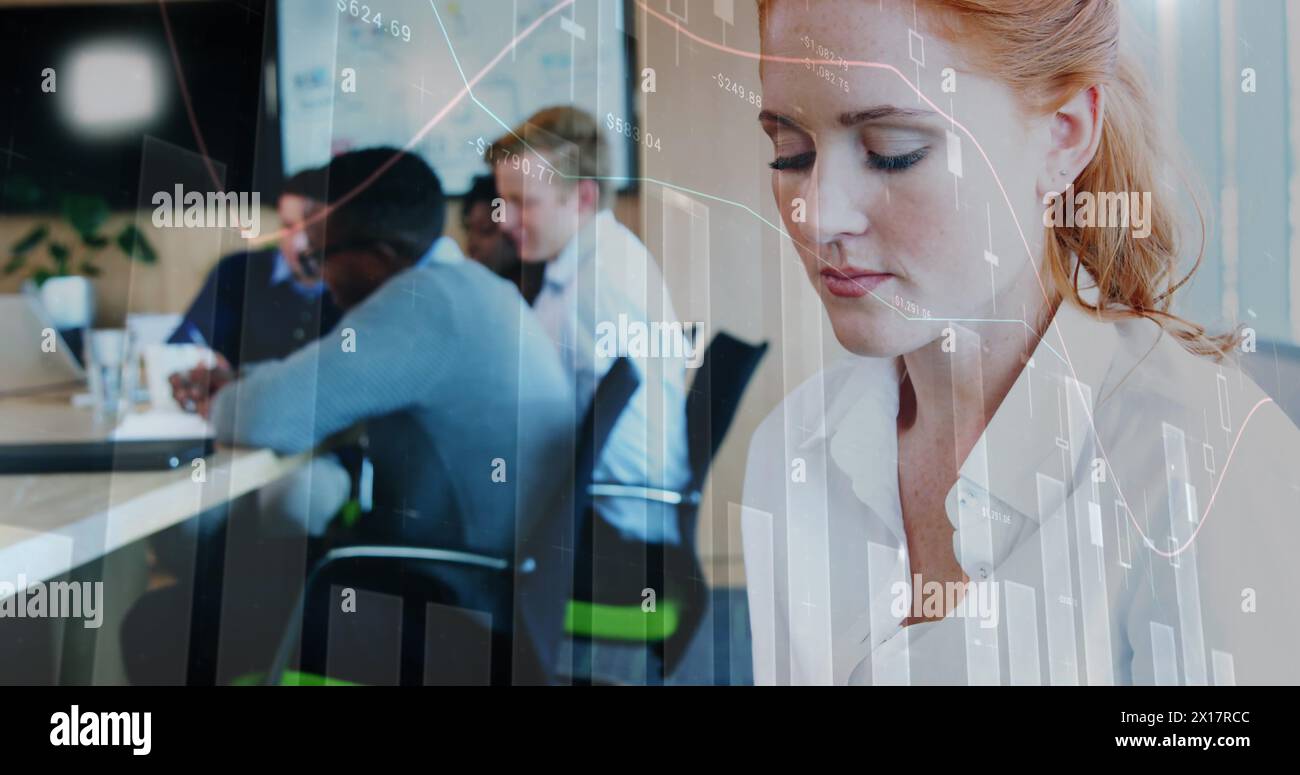 A female executive is using a digital tablet at her office Stock Photo