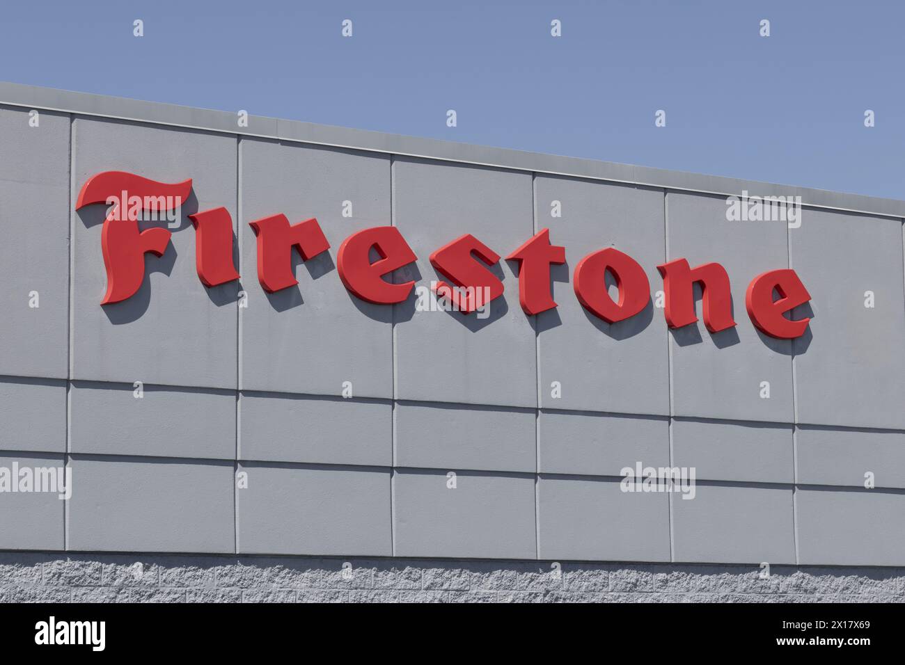 Indianapolis - April 13, 2024: Firestone Tire sign. Firestone is the official tire of IndyCar and the Indianapolis 500. Stock Photo
