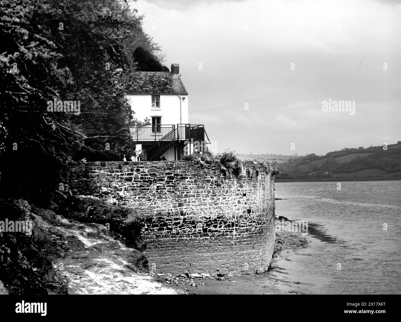 Dylan Thomas’ boathouse, overlooking the estuary where the river Taf flows into Carmarthen Bay at Laugharne. Stock Photo
