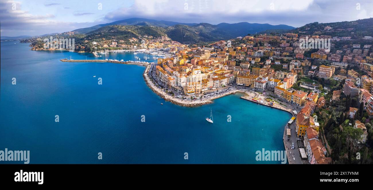 Italy , Tuscany summer destination- beautiful coastal town Porto Santo Stefano , Grosseto province. Panoramic aerial drone view Stock Photo