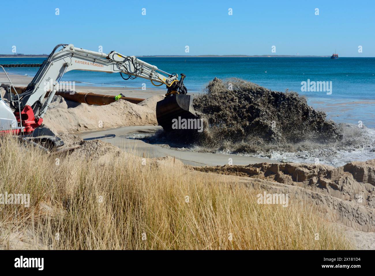 Renaturation, Repair of erosion-damaged beach. Sand is sucked up from the seabed and pumped via pipeline to the beach in Ystad, Skane, Sweden Stock Photo