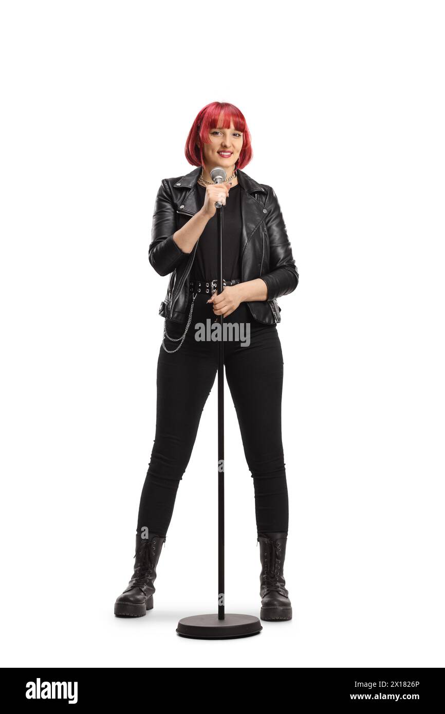 Rock female singer with a microphone isolated on white background Stock Photo