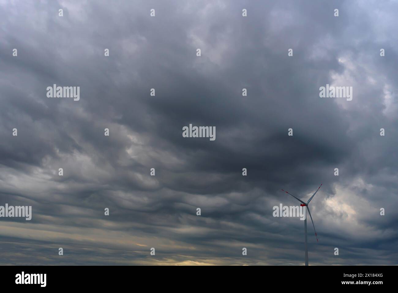 Wind turbine with rain clouds (Nimbostratus), Mecklenburg-Vorpommern, Germany Stock Photo