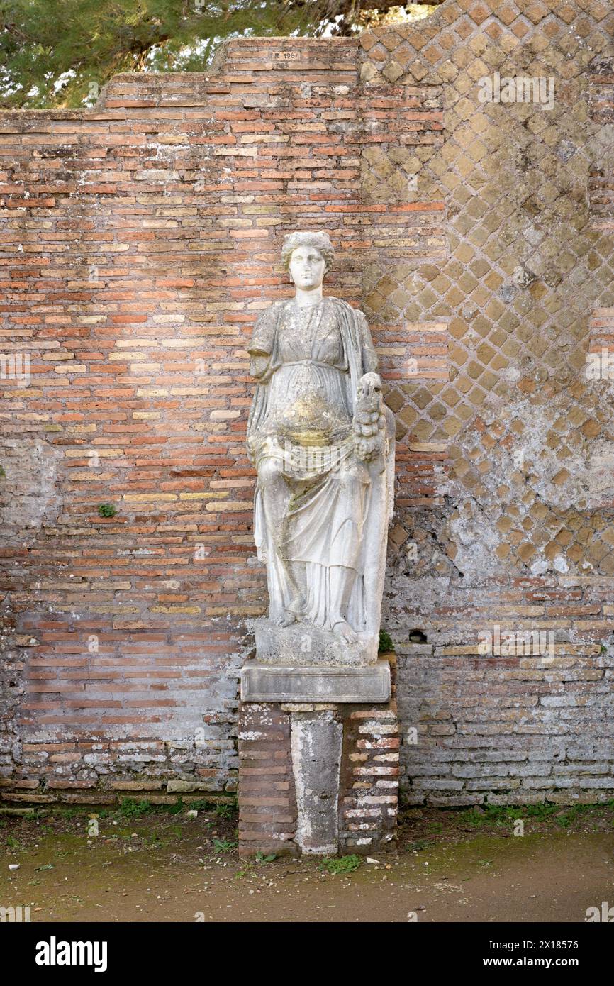 The statue (probably personification of Ostia) in Ostia Antica. Ruins of ancient roman city and port. Rome, Latium, Italy Stock Photo