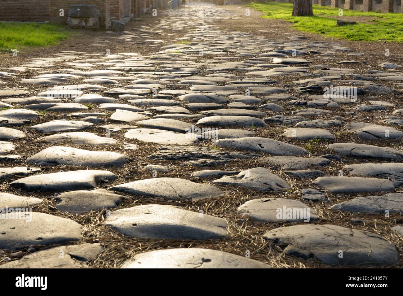Ancient roman road in Ostia Antica. Rome, Latium, Italy Stock Photo - Alamy