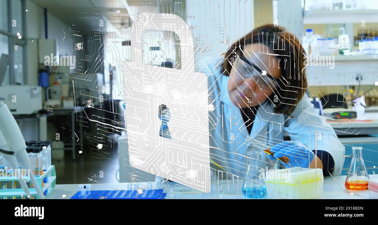 Image of padlock over caucasian female scientist in lab Stock Photo