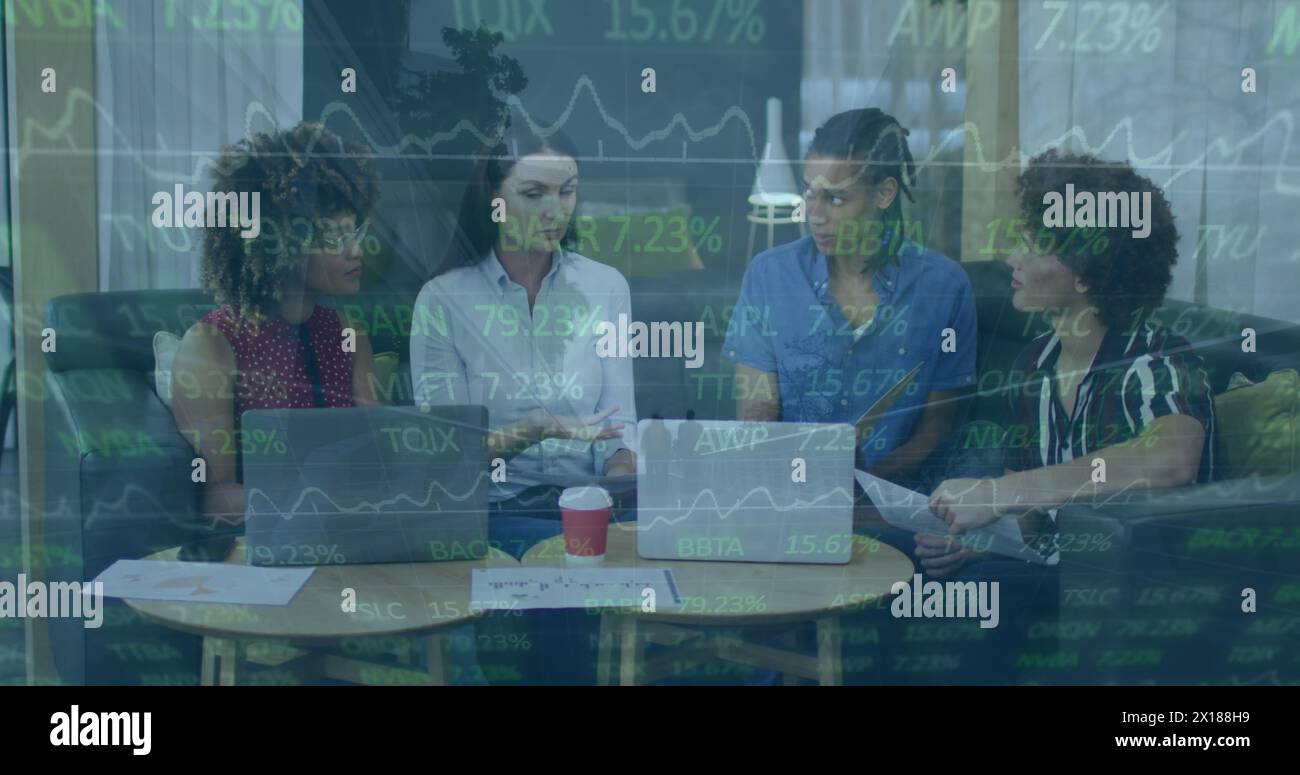 Image of statistics and financial data processing over diverse business people in office Stock Photo