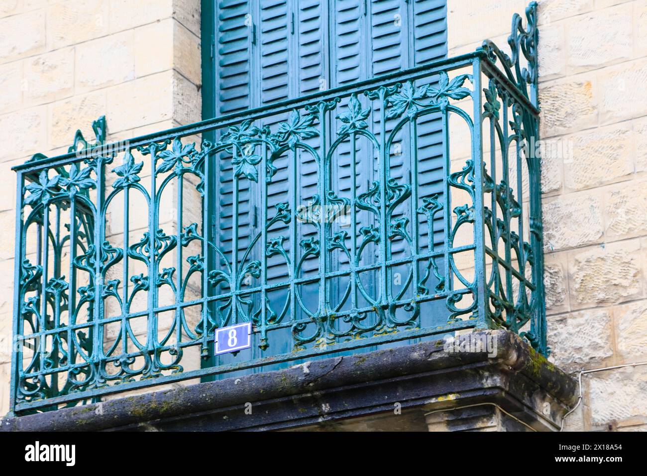 Window railings and balconies on residential buildings designed by Hector Guimard in the Art Nouveau style and produced in the municipal metal Stock Photo